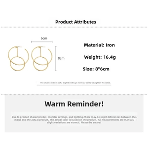 Detail showing oversized double gold hoop earring dimensions and iron material specifications