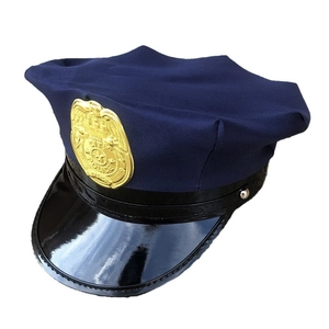 Detailed view of city police hat with golden badge and glossy black patent leather brim