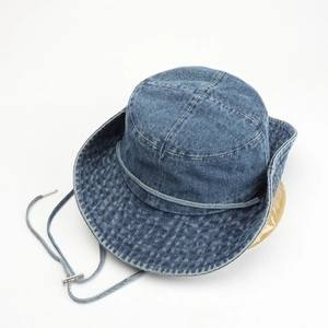 Washed blue denim bucket hat with adjustable chin strap and polished metal buckle