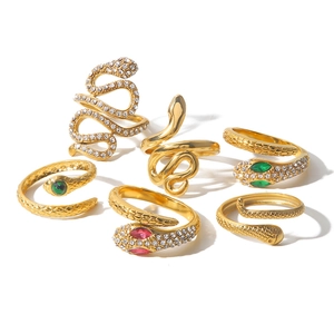 Set of six gold stainless steel snake rings with sparkling red, green, and clear crystals