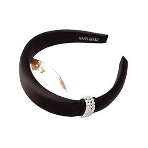 Fashionable black satin headband with white pearl rows for a high crown hairstyle look