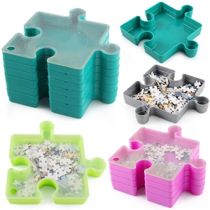 Set of 4 colorful stackable jigsaw puzzle sorting trays with lids for easy organization