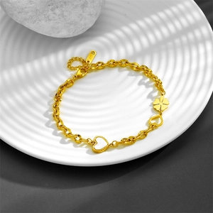 Elegant gold stainless steel bracelet with clover and white shell heart charms