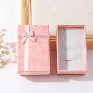 Pink textured jewelry gift box with bow ribbon for rings and earrings set with foam insert