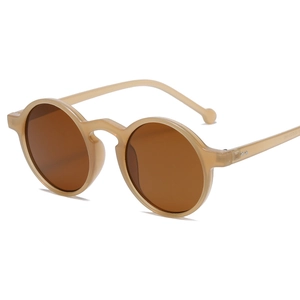Retro round tea-colored translucent sunglasses with dark brown lenses and metal studs