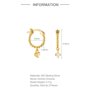 Detail showing 925 sterling silver gold beaded earrings with sparkling cubic zirconia