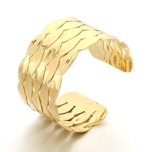 Wide gold stainless steel open cuff bracelet with layered leaf texture and polished finish