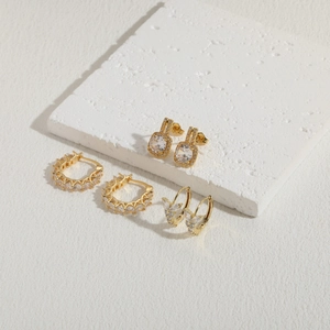 Three-piece gold plated zircon earring set featuring square, hoop, and butterfly designs