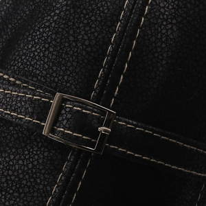 Close-up of black PU leather texture with contrast stitching and silver square buckle