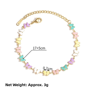 Detail of 18K gold stainless steel bracelet with colorful enamel butterfly charms