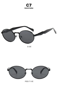 Detail view of oval black sunglasses featuring metal hinges and transparent nose pads