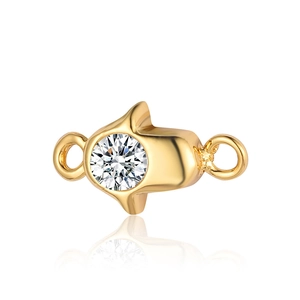 Detailed view of a golden Hamsa Hand pendant with a central round gemstone for DIY jewelry