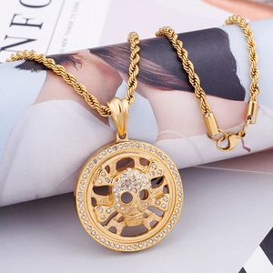 Close-up of hip-hop skull pendant with sparkling rhinestones and golden rope chain