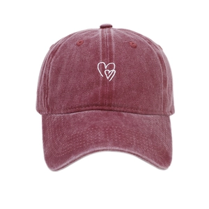 Vintage washed red baseball cap with white heart embroidery and adjustable cotton strap