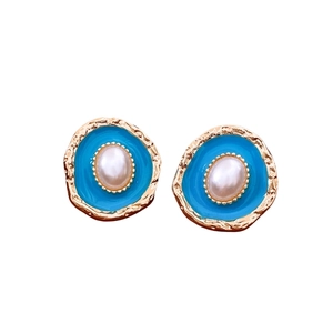 Vintage gold oval stud earrings with turquoise enamel and centered faux pearl