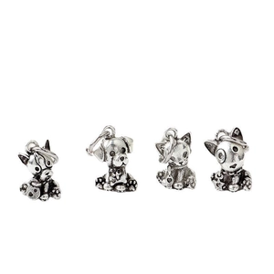 Detail of four silver-tone alloy animal paw and cat charms for beaded bracelets