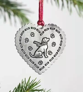 Silver heart metal ornament with dog wearing scarf engraving and red ribbon detail