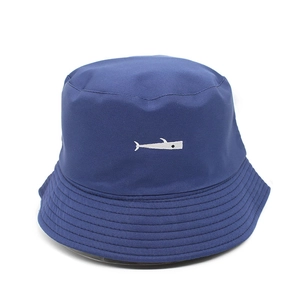Navy blue cotton sun hat with white fish embroidery on a clean white background