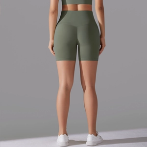 Detail of high-waisted olive green yoga shorts showing seamless back and lifting cut