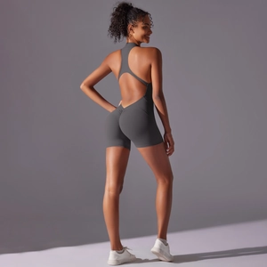 Detail of deep grey yoga bodysuit featuring open back cutout and scrunch butt design