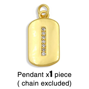 Close-up of golden rectangular pendant featuring vertically set round clear zircons
