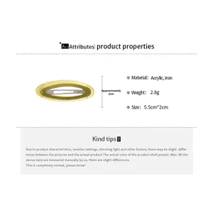 Detail view of yellow acetate hair clip showing 5.5cm size and 2.8g weight specifications