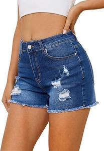 Detail of high waisted dark blue denim shorts with distressed holes and raw hem edges