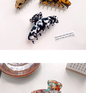 Flat lay of small leopard print acetate claw clips with various tortoise patterns