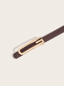 Detailed view of a brown leather belt featuring a golden G-shaped metal buckle and neat stitching
