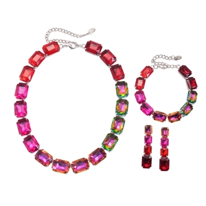 Three-piece jewelry set with square pink crystal necklace, bracelet, and earrings