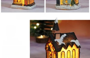 Detailed view of luminous resin Christmas cottage with warm LED lighting and snow-covered roof