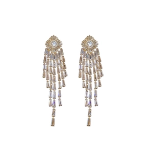Elegant gold plated rhombus tassel earrings with sparkling cubic zirconia on white background