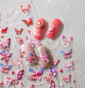 Macro shot of 5D butterfly nail art stickers with iridescent pink and purple butterfly decals
