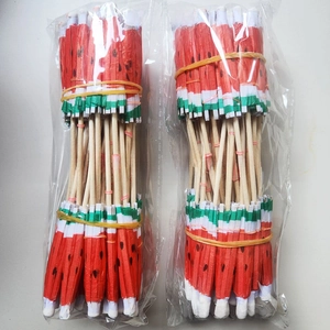 Detail of watermelon cocktail picks made from natural wood and paper for summer parties