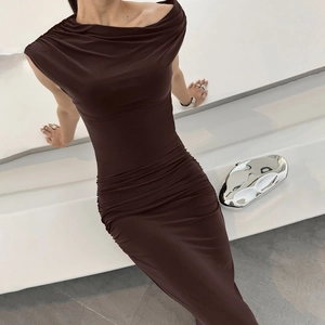 Detail of the ruched halter neckline and slim fit design on a brown summer dress