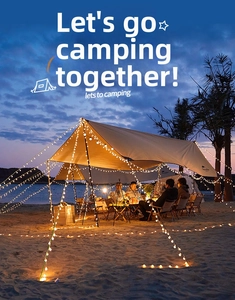 Outdoor camping scene featuring a large canopy tent decorated with warm LED string lights