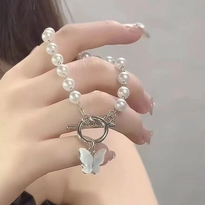 Elegant pearl butterfly bracelet with silver chain and T-bar clasp for women