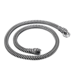 Retro silver snake head necklace in surgical steel featuring a textured snake bone chain