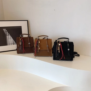 Bolsos bandolera vintage para mujer en cuero marrón y negro con textura de ante