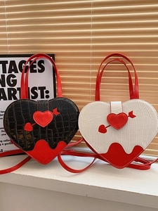 Chic heart-shaped crossbody bags in crocodile pattern leather with unique lava-style trim