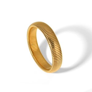 Detail of 18K gold-plated Tubogas snake-shaped stretch bracelet with polished metallic texture
