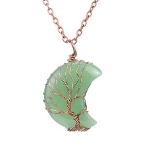Detail showing handmade copper wire tree of life wrapped around a green crescent moon stone
