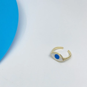 Minimalist gold evil eye ring with blue enamel and adjustable open band on white background