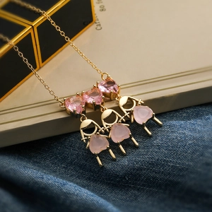 Gold necklace with three pink heart-shaped zircon pendants in a girl figure style