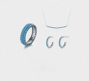 Detail of S925 silver jewelry set with turquoise star necklace, ring, and hoop earrings