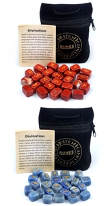 Detail of red and blue natural crystal rune stones with embroidered velvet pouch and card