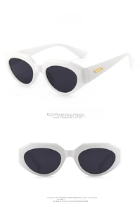 Detail of white chunky sunglasses with grey lenses and gold metal temple accents