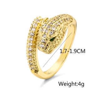 Detail showing 18K gold plated leopard head ring with green stone eyes and 4g weight