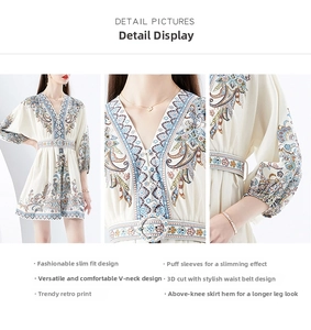 Detail view of V-neckline and paisley print on vintage-style mini dress with bubble sleeves