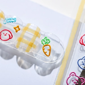Cute cartoon nail stickers featuring hand-drawn dogs and stars on a transparent base